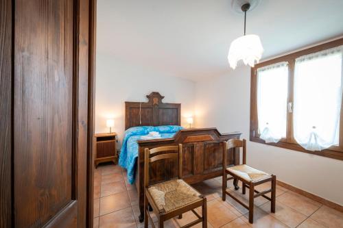 Postel nebo postele na pokoji v ubytování Albergo Diffuso Forgaria Monte Prat