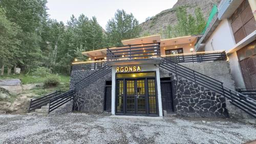 a building with a yellow door on the side of it at RGONSA hotel in Skardu
