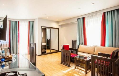 a living room with a couch and a table at Haz Boutique Hotel Baku in Baku