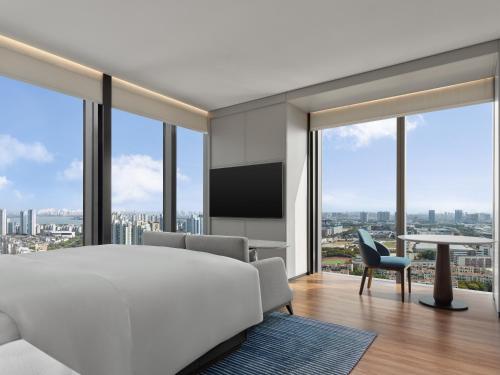 Ένα ή περισσότερα κρεβάτια σε δωμάτιο στο Marriott Executive Apartments Suzhou Industrial Park