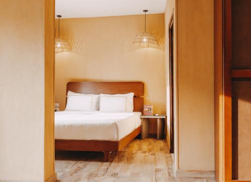 a hotel room with a bed and a hallway at Almas Pyramids Hotel in Cairo