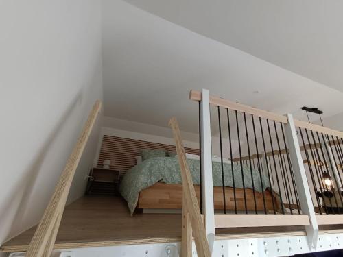 Postel nebo postele na pokoji v ubytování Mezzanine Clarette