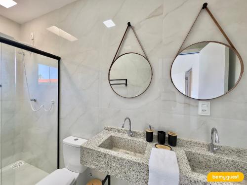 a bathroom with a sink and a mirror at Bella Arte 2 Rooftop in Aquiraz
