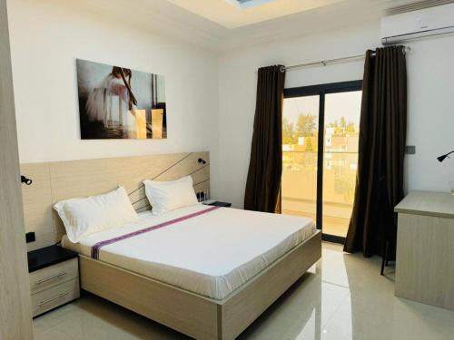 Postel nebo postele na pokoji v ubytování Le Corossolier 404 - Studio chic 4e étage aux Maristes