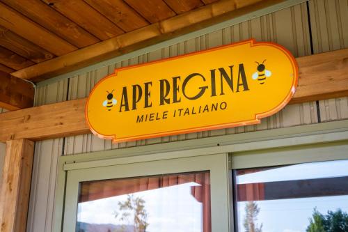 an orange sign on the side of a building at Palagina Il Borgo Agricolo in Figline Valdarno