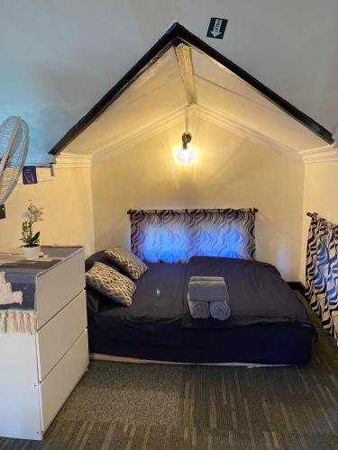 a bedroom with a large bed in a room at Abe cottage in Kampung Kuala Besut