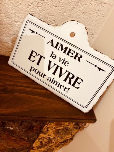 a sign that reads answer let me let wine pour amen at Domaine FINCA LESSYA, Lodge insolite & SPA in Mauguio