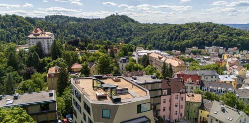 an aerial view of a town in the mountains at Unique Penthouse with terrace and exceptional view in Karlovy Vary