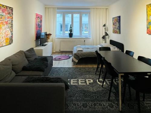 a living room with a couch and a table at City-Apartment near Stephansdom in Vienna