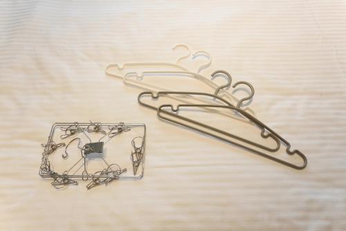 a pair of metal hooks sitting on a table at Direct 6min to Nagoya Sta Max4ppl 1BDR Wi-Fi in Aoichō