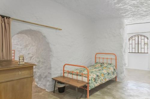 Ένα ή περισσότερα κρεβάτια σε δωμάτιο στο Casa Cueva Rural, Calima