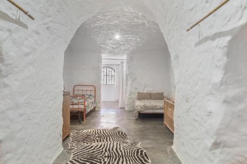 Ένα ή περισσότερα κρεβάτια σε δωμάτιο στο Casa Cueva Rural, Calima