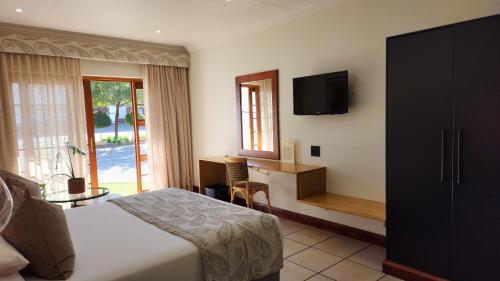 Ένα ή περισσότερα κρεβάτια σε δωμάτιο στο Shonalanga Lodge