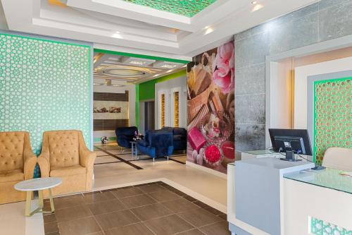 a lobby with a waiting room with chairs and a table at Pickalbatros Palace - Aqua Park Hurghada in Hurghada