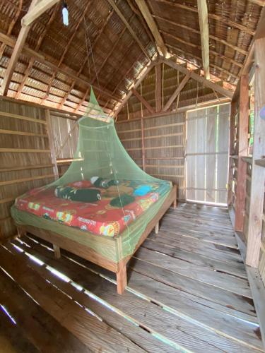 Postel nebo postele na pokoji v ubytování Keruwo Homestay