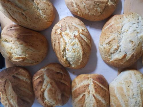 a bunch of loaves of bread in a box at Moara Viselor in Vaideeni
