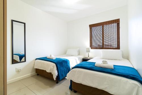 Giường trong phòng chung tại Citystay Apartments Century City