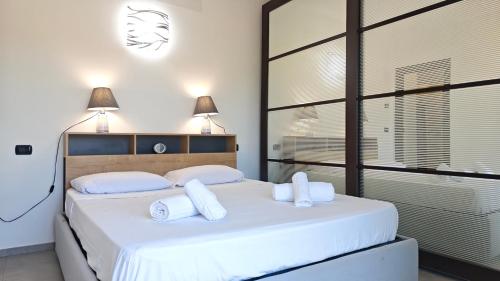 Ένα ή περισσότερα κρεβάτια σε δωμάτιο στο Hostdomus-Azimut