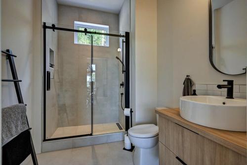 a bathroom with a shower and a sink and a toilet at Kensho Enjoy nature life with Hot tub in Sainte Béatrix