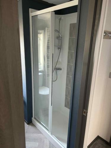 a glass shower stall in a bathroom at Parkview holiday lodge in Lossiemouth