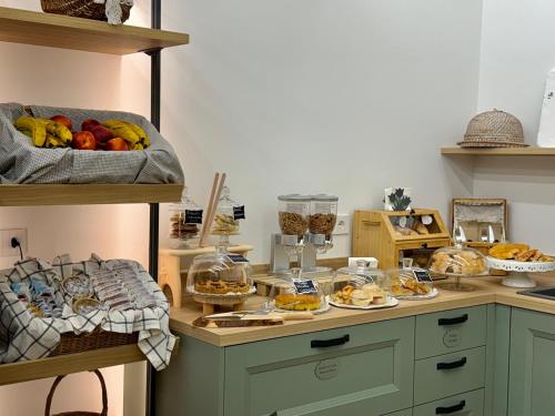 a counter with a bunch of food on it at Country Rooms Medicina B&B - Free Breakfast - Air Conditioning - WiFi in Medicina