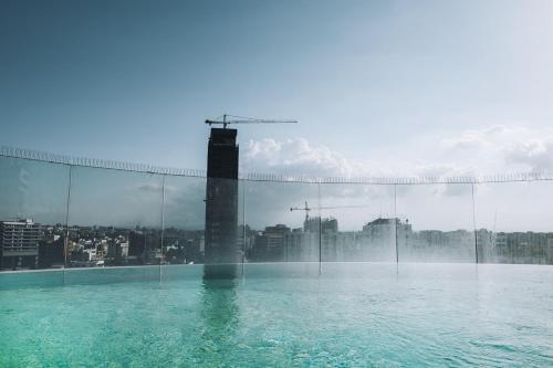 a swimming pool with a view of a city at The 1 -Nicosia Luxe Stay- Gym Pool 24h Concierge in Nicosia