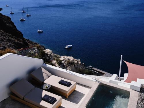 a view of the ocean from a house at Andronis Luxury Suites in Oia