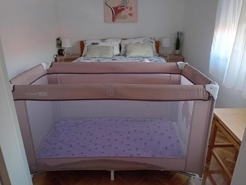 Postel nebo postele na pokoji v ubytování Apartmani Ani