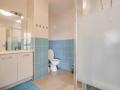 a bathroom with a toilet and a glass shower at Appartement de standing 8 pers, hyper centre Arcachon, balcon, parking privé, proche plages et gare - FR-1-474-28 in Arcachon