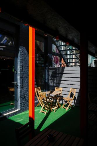 two chairs and a table on a patio at Sleephotels Cosmos in Hamburg