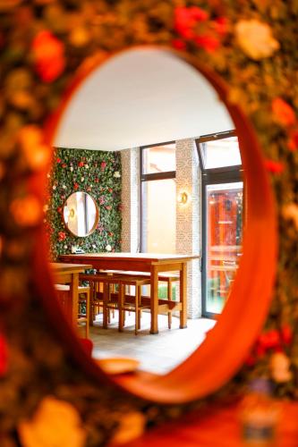 a dining room with a table and a window at Sleephotels Cosmos in Hamburg