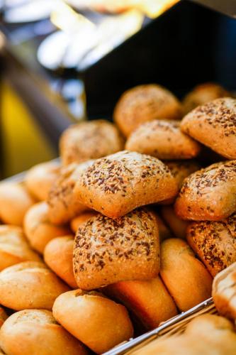a pile of bagels piled on top of each other at Sleephotels Cosmos in Hamburg