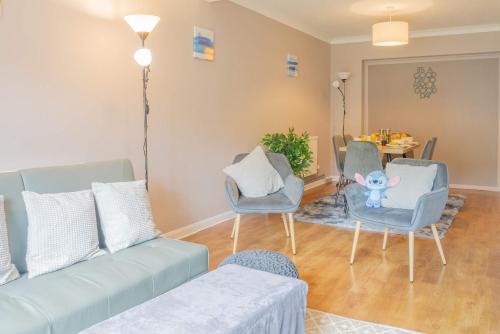 a living room with a couch and chairs and a table at 4 Bed House Perfect for Contractors - Families and Relocation in Stoughton