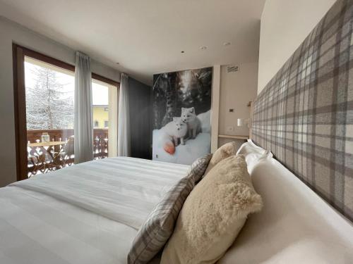 Postel nebo postele na pokoji v ubytování Alpine Rooms and Suites Livigno - Camana Noa -