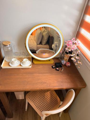 a mirror on top of a table with a couch at Sunset Hill Cabins in San Fabian
