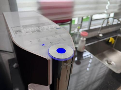 a counter on a bus with a control panel at TropINN LoDonHeartBeat 5LuxRoom CirPool BBQ & KTVFun in Bandar Penawar