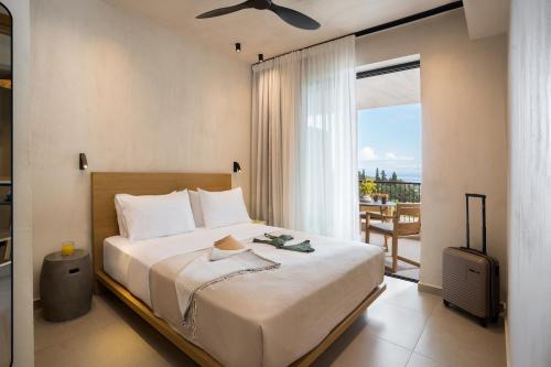 Postel nebo postele na pokoji v ubytování Pnoes Luxury Suites