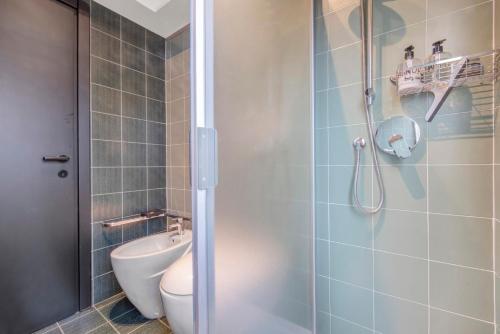 a bathroom with a toilet and a shower at Lake Como Design Home in Lecco