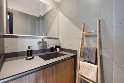 a bathroom with a sink and a mirror at Lake Como Design Home in Lecco