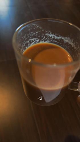 a cup of coffee sitting on top of a table at Surya hills view in Jāmb