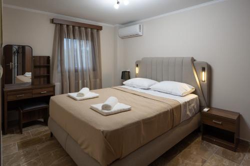 Ένα ή περισσότερα κρεβάτια σε δωμάτιο στο Olympus Echo Villa