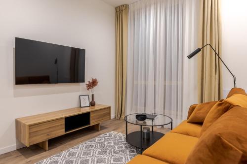 Una televisión o centro de entretenimiento en FORUM apartments