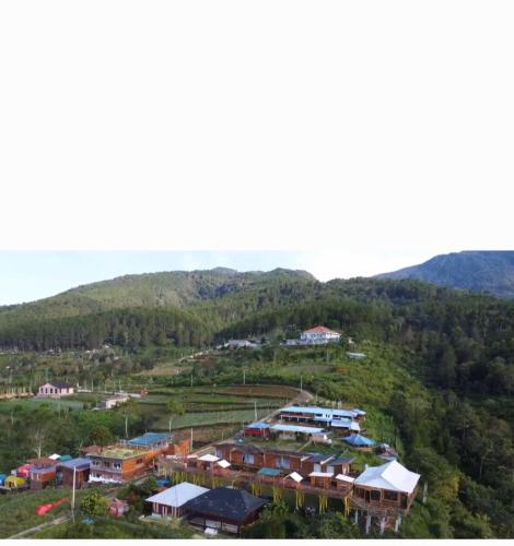 an aerial view of a village in the mountains at Varvara hill in Cigugur