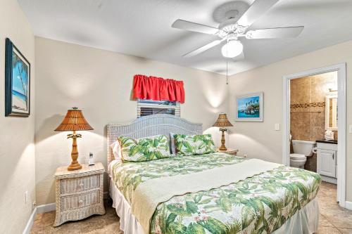 a bedroom with a bed and a ceiling fan at Tidal Wave - In Siesta Key Village, Pet Friendly, Private Pool! in Siesta Key