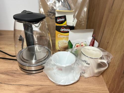 a counter top with a blender and some food at Hotel Bosna in Kladanj
