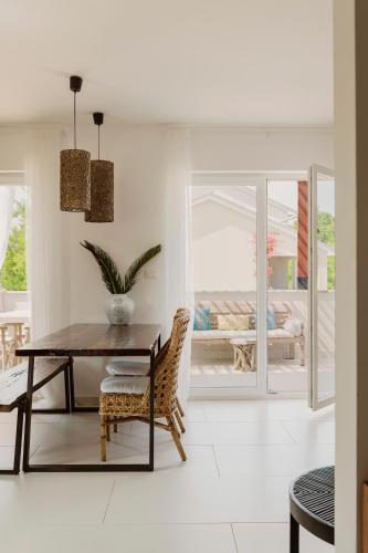a dining room with a table and chairs at Galboka Residence in Nerezine