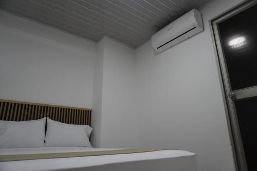 Postel nebo postele na pokoji v ubytování Hotel Gama Cartagena