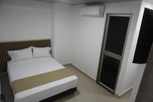 Postel nebo postele na pokoji v ubytování Hotel Gama Cartagena