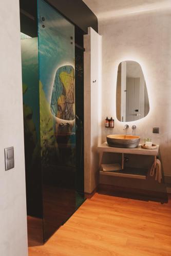 a bathroom with a sink and a mirror at Santa Cruz - Movement & Nature House in Santa Cruz