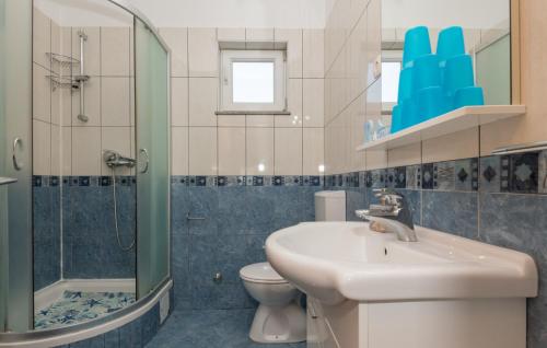 a bathroom with a sink and a shower and a toilet at Villa Bilanzic - Omis by Villas Guide in Kreševo